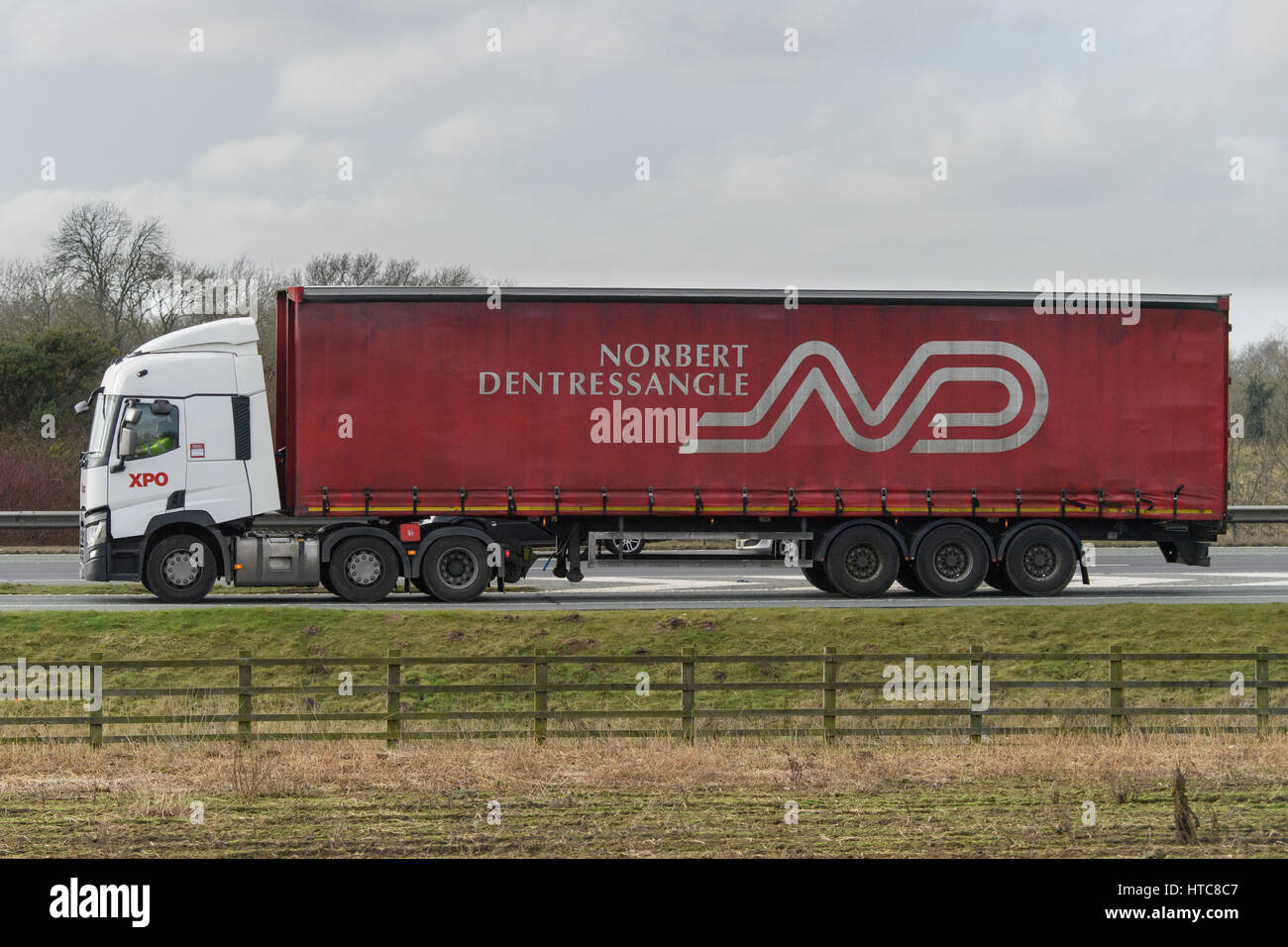 Distribution & transportation - Norbert Dentressangle articulated lorry, heavy goods vehicle (HGV) travelling on the A1 motorway - England, GB, UK. Stock Photo