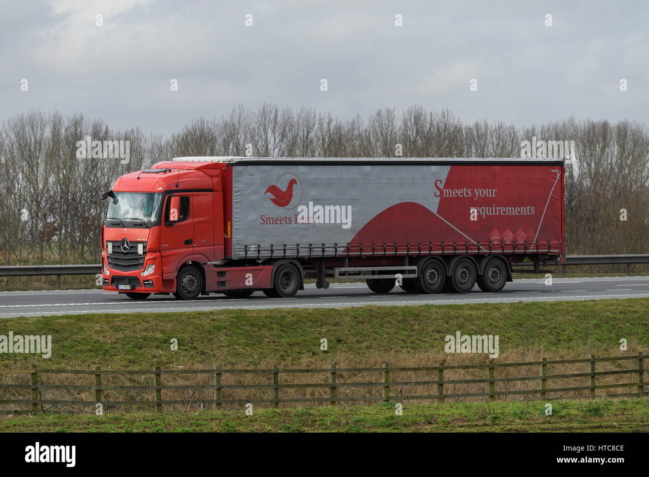 Distribution & transportation - articulated lorry, heavy goods vehicle (HGV) with Smeets Ferry logo, travelling on the A1 motorway - England, GB, UK. Stock Photo