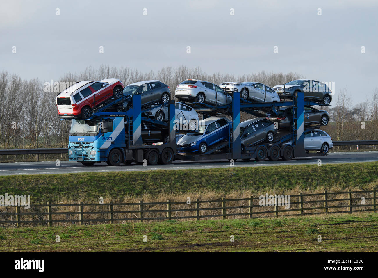 Distribution & transportation - loaded ECM car transporter (articulated lorry, heavy goods vehicle, HGV) travels on the A1 motorway - England, GB, UK. Stock Photo