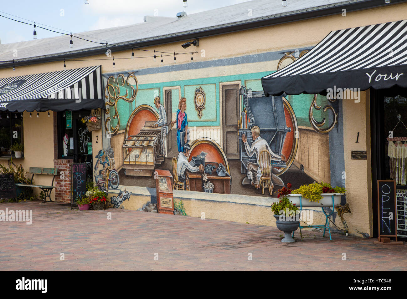 Art murals painted on outdoor building walls in Lake Placid Florida known as the Town of Murals Stock Photo