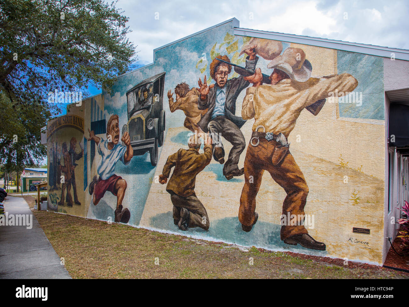 Art murals painted on outdoor building walls in Lake Placid Florida known as the Town of Murals Stock Photo