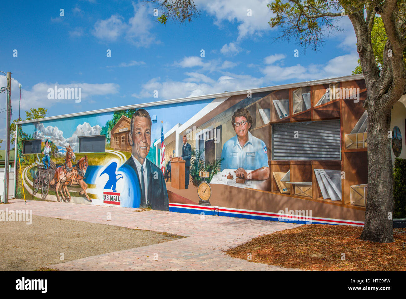Art murals painted on outdoor building walls in Lake Placid Florida
