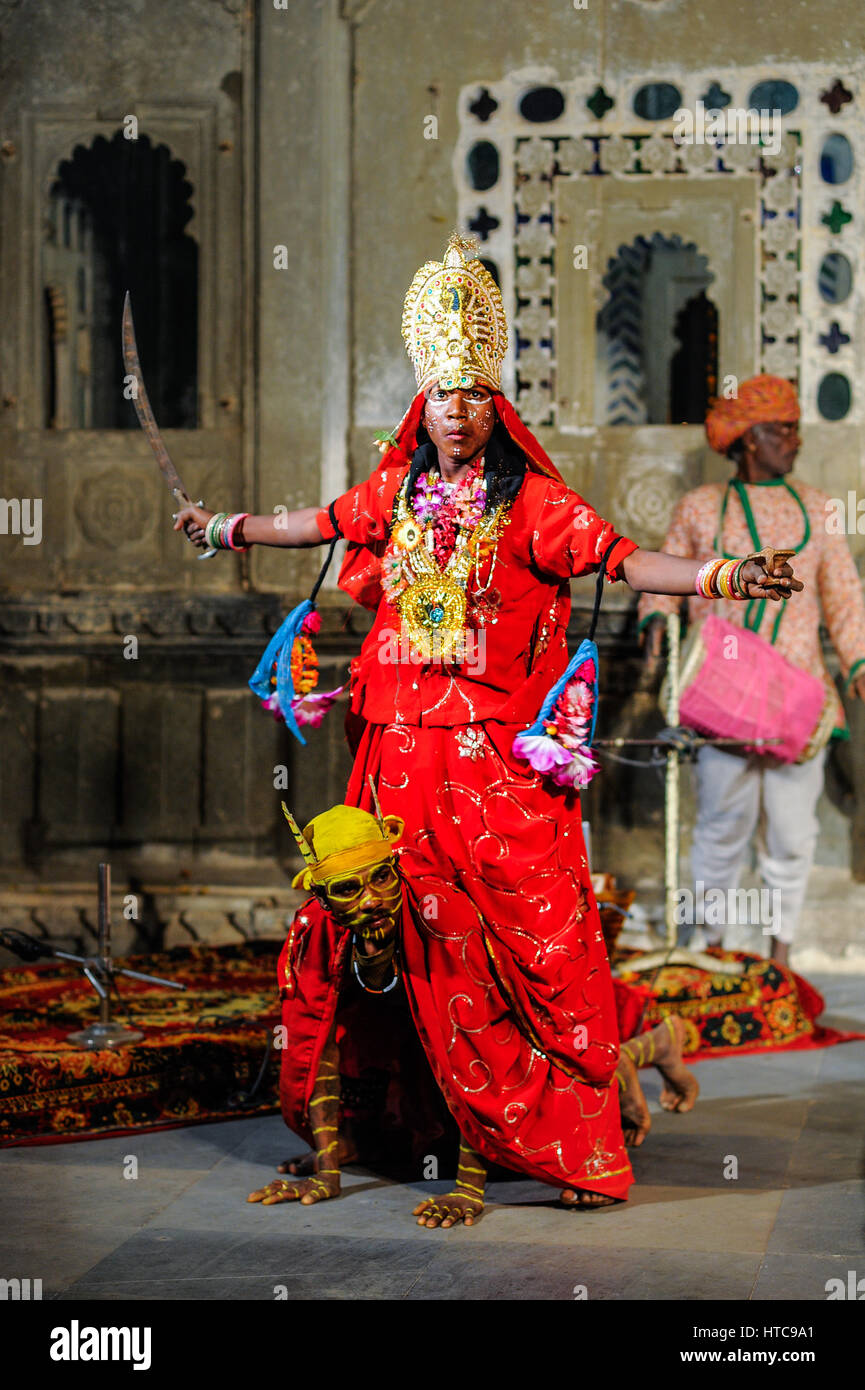 Men dress as Durga and her tiger vehicle at at Bagore Ki Haveli evening show in Udaipur Stock Photo Alamy