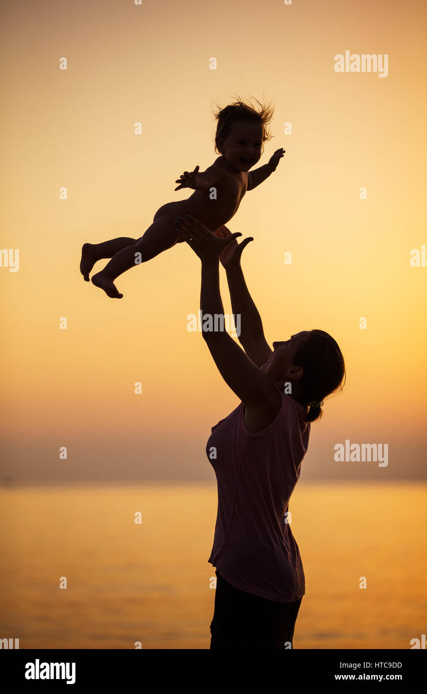 Mom throwing baby in air hires stock photography and images Alamy