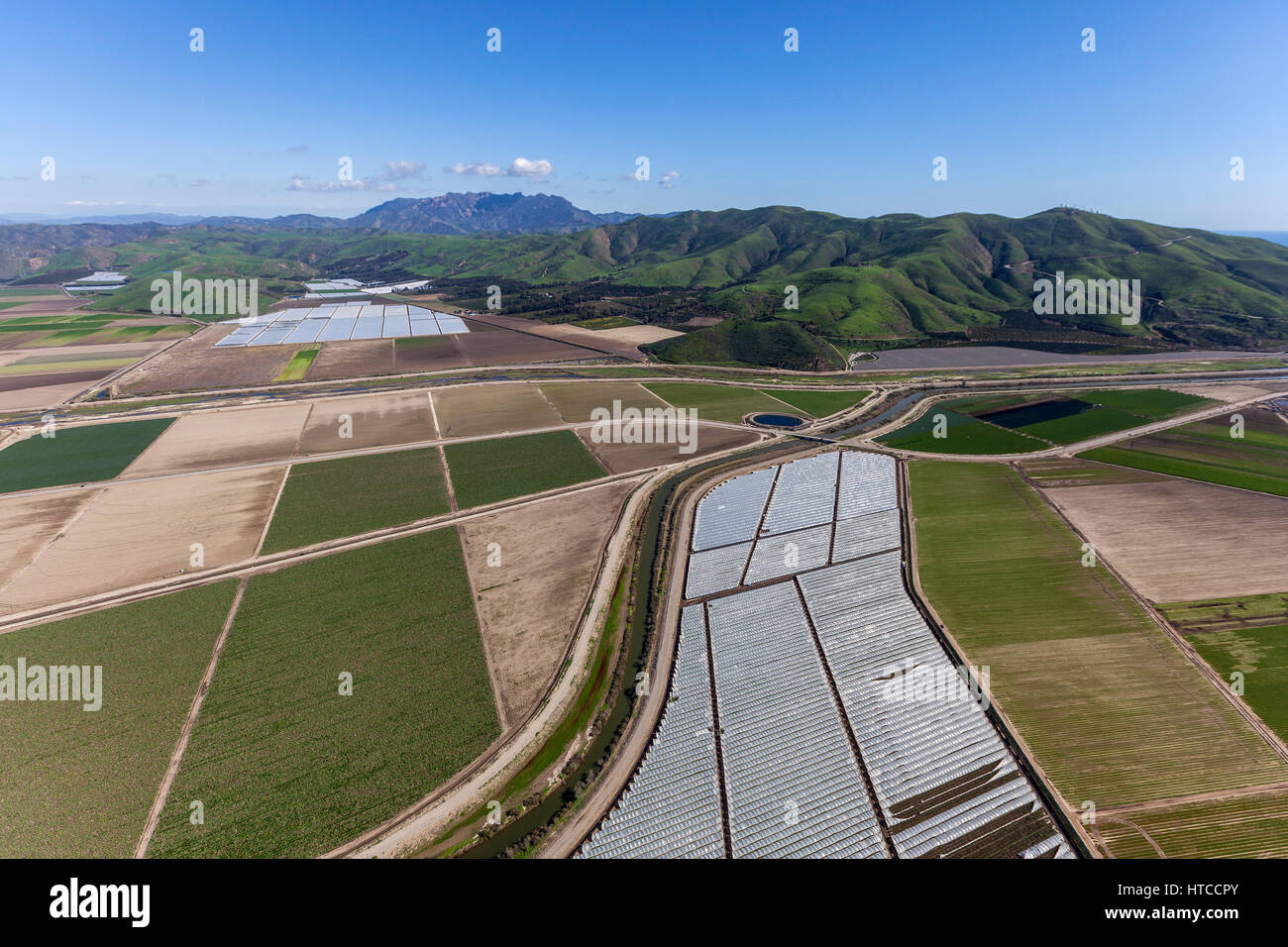 Aerial view of agricultural land and Santa Monica Mountains peaks in