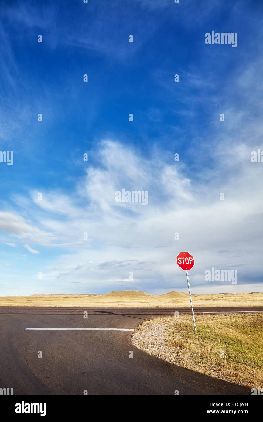 Desert highway with a stop sign, concept picture, USA. Stock Photo