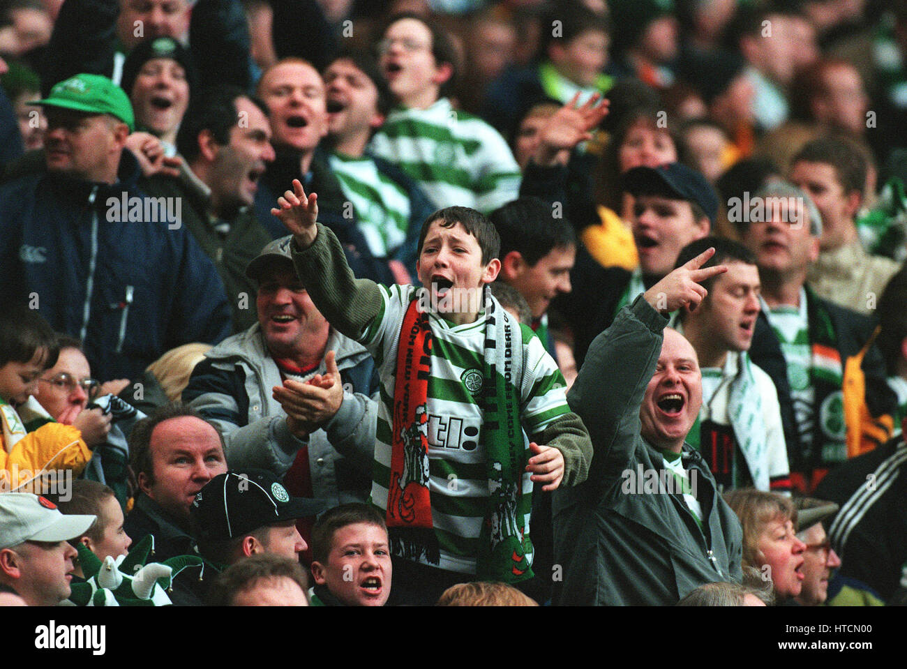CELTIC FANS TAUNT RANGERS FANS CELTIC V RANGERS 27 December 1999 Stock