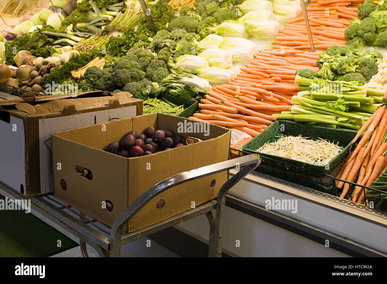 Vegetables on a supermarket shelf Stock Photo