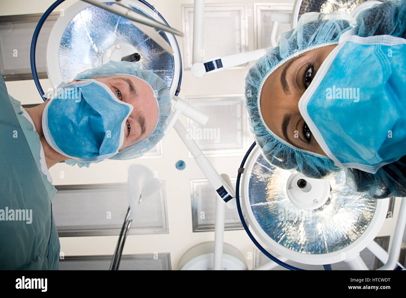 Surgeons looking down Stock Photo - Alamy