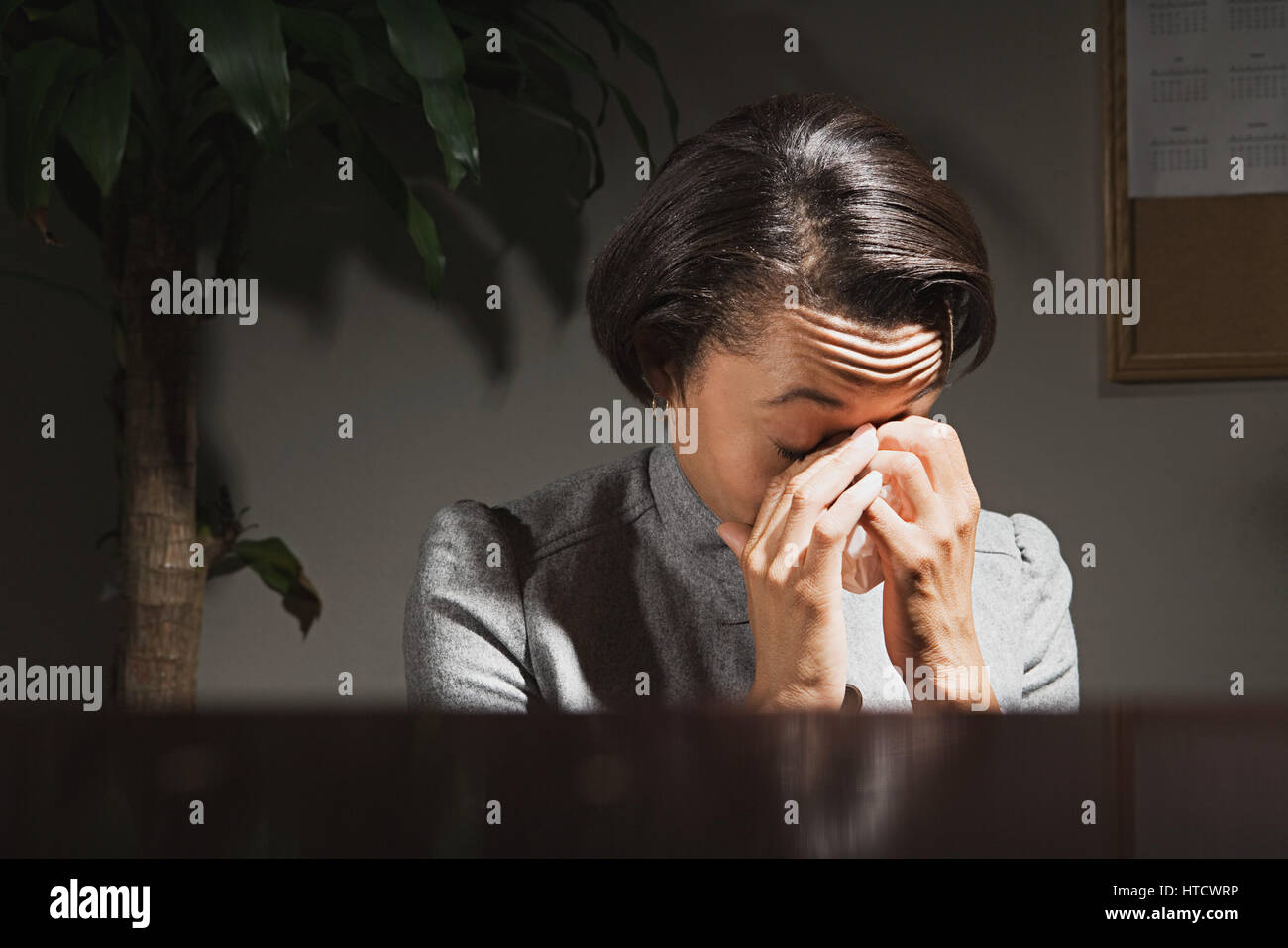 Crying woman head in hands hi-res stock photography and images - Alamy