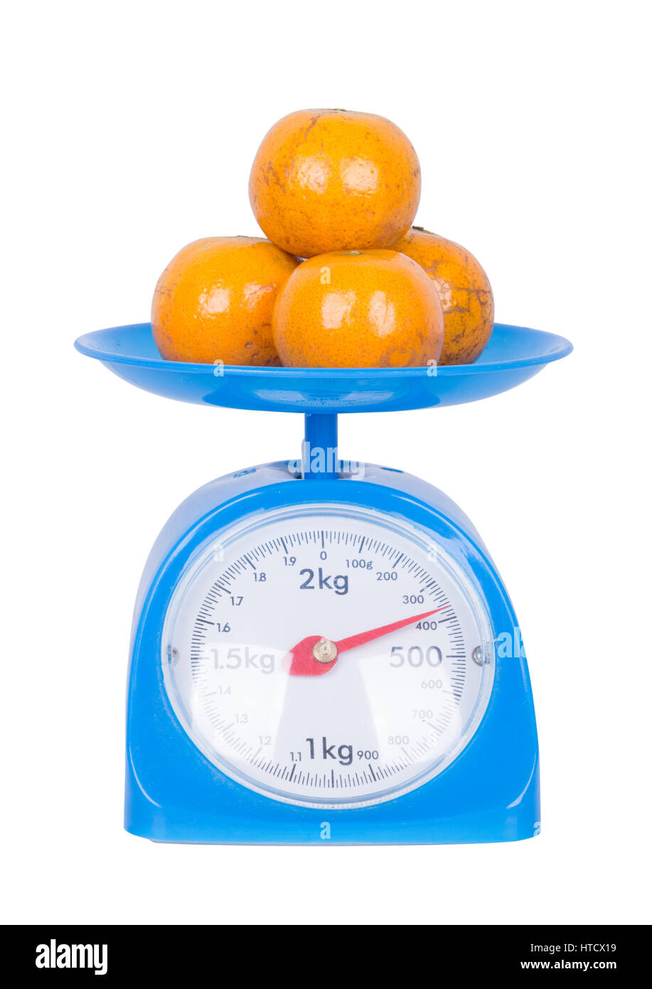 orange on kitchen scale isolated on white background (with clipping path) Stock Photo