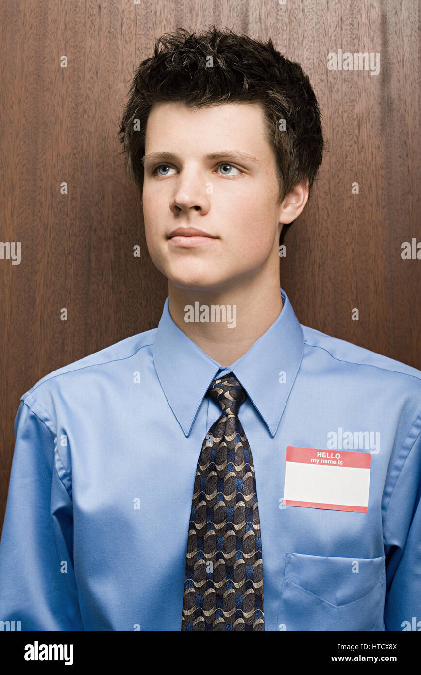 Businessman wearing name tag Stock Photo Alamy