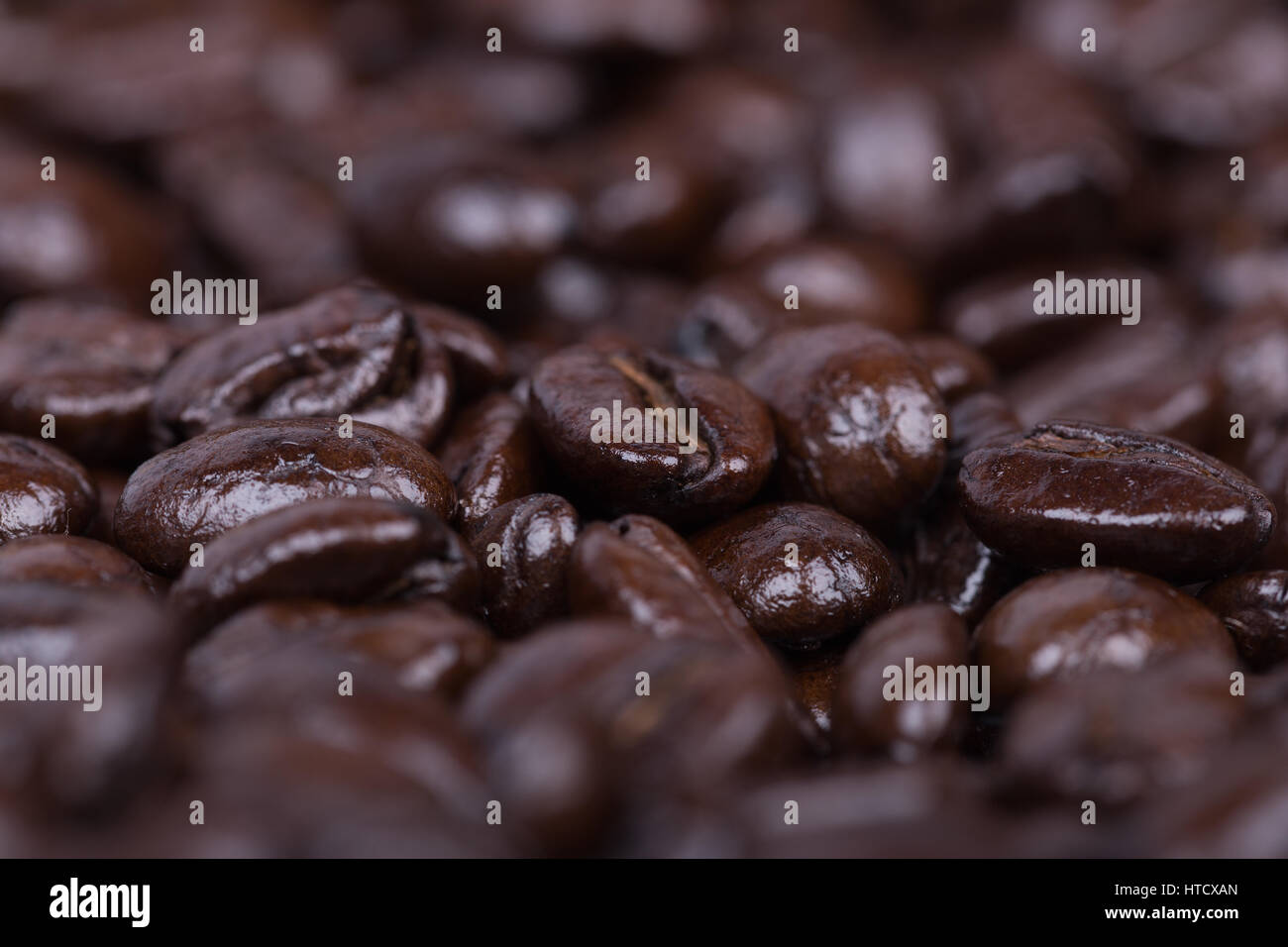 close up Roasted Coffee Beans background texture Stock Photo - Alamy