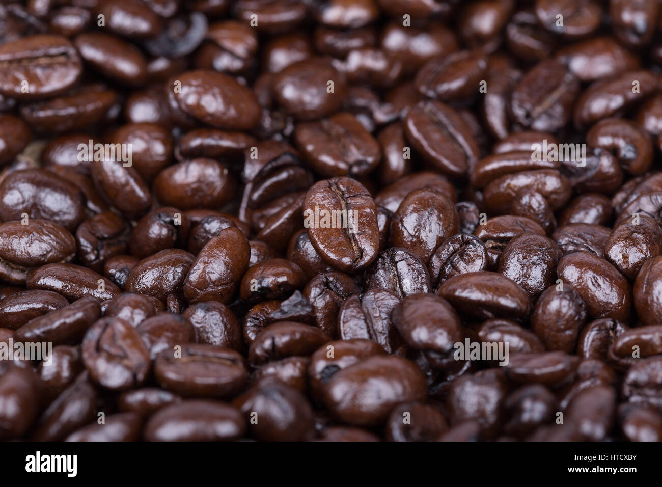 close up Roasted Coffee Beans background texture Stock Photo - Alamy