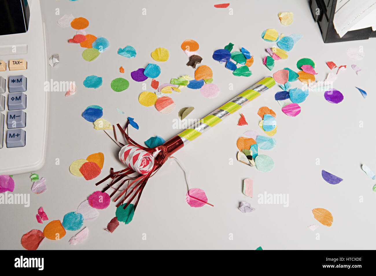 Party horn blower on office desk Stock Photo - Alamy