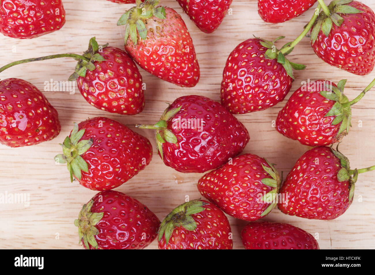 Fresh ripe strawberry on wood background Stock Photo - Alamy
