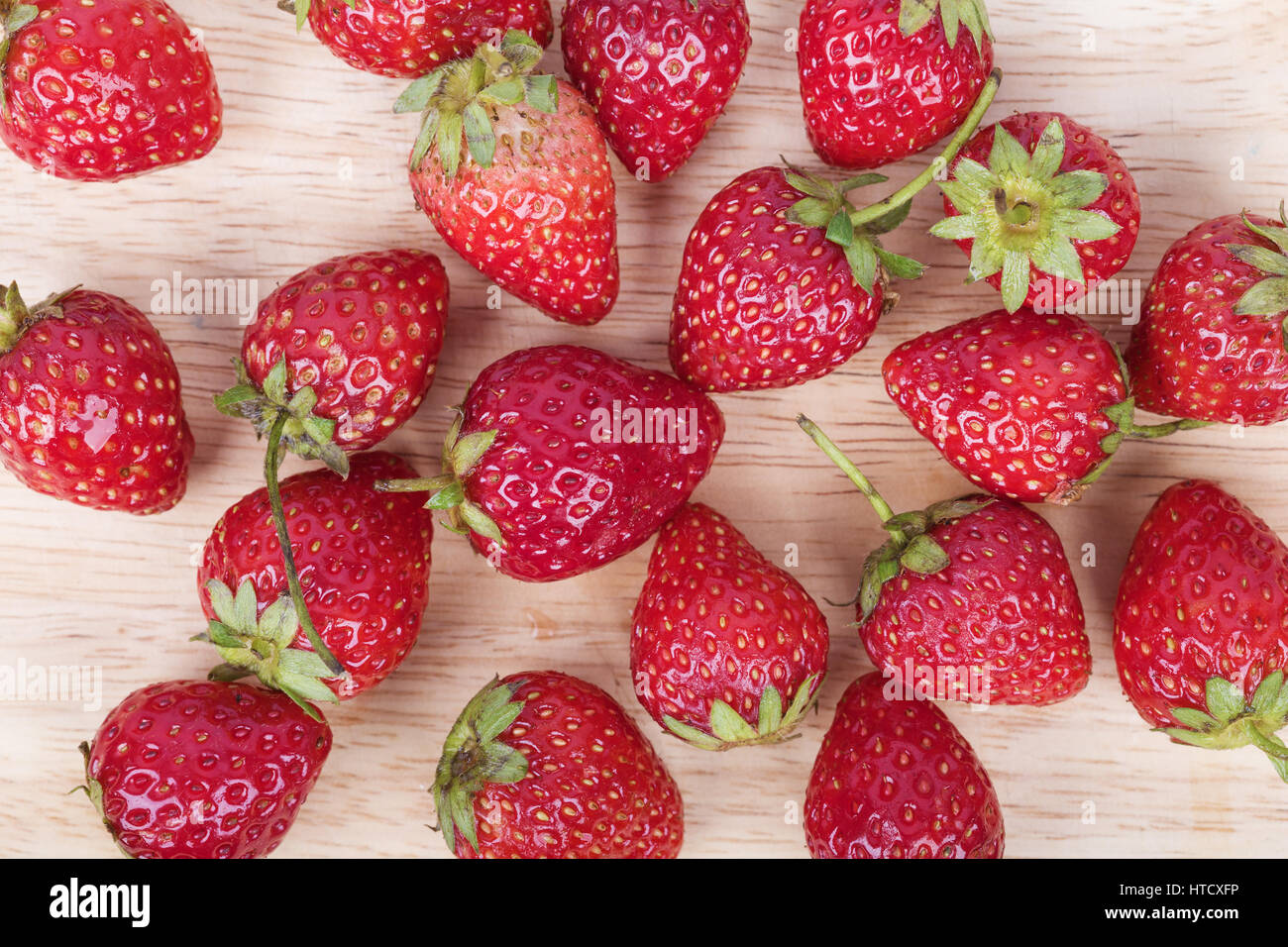 Fresh ripe strawberry on wood background Stock Photo - Alamy