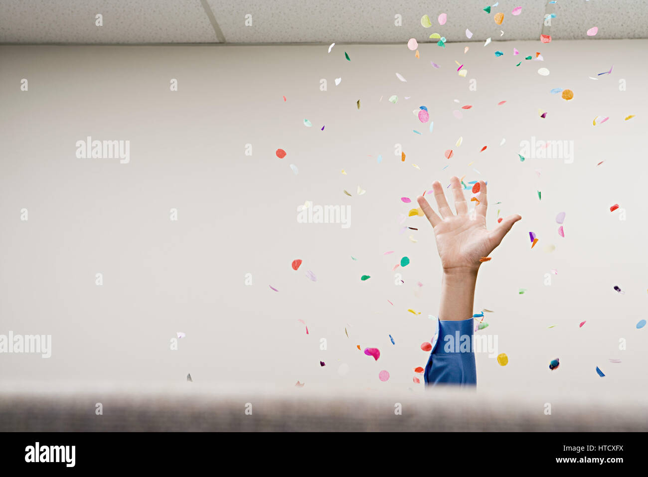 Businessman throwing confetti in the air Stock Photo Alamy