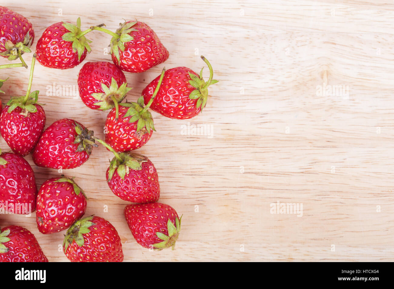 Fresh ripe strawberry on wood background blank for text Stock Photo - Alamy