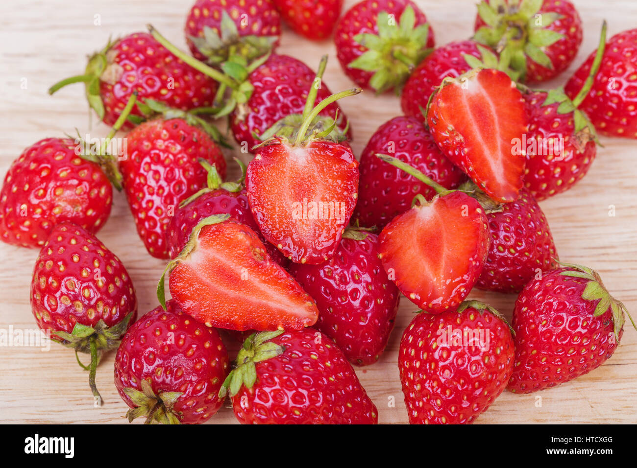 Fresh ripe strawberry on wood background Stock Photo - Alamy