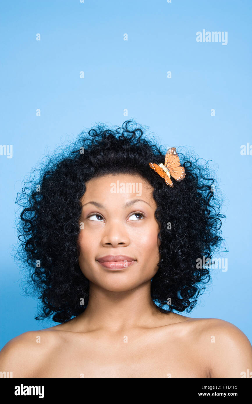 Woman with flower in her hair Stock Photo Alamy