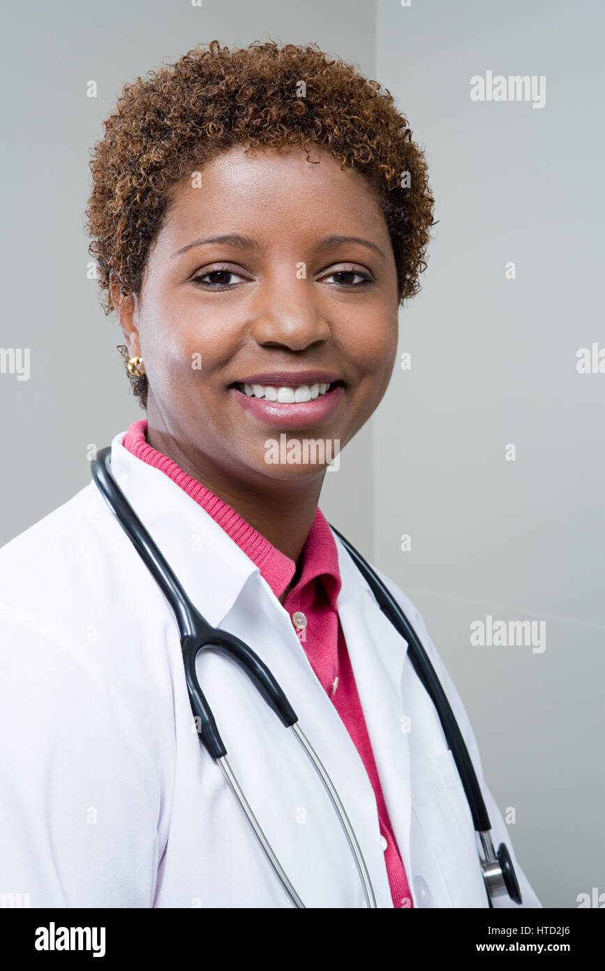 Portrait smiling happy doctor curly hi-res stock photography and images ...