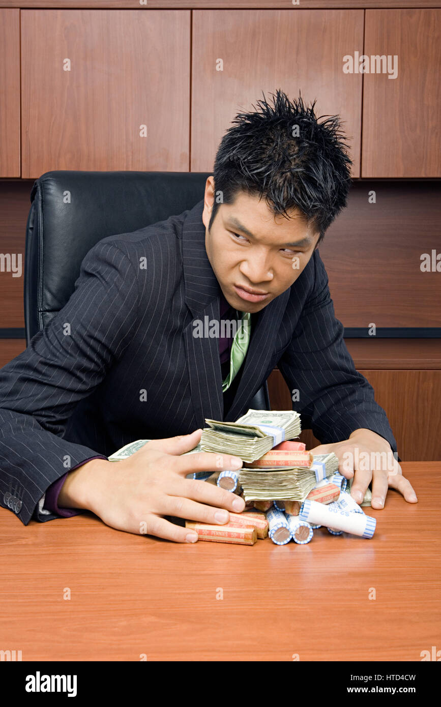 Businessman holding money Stock Photo - Alamy
