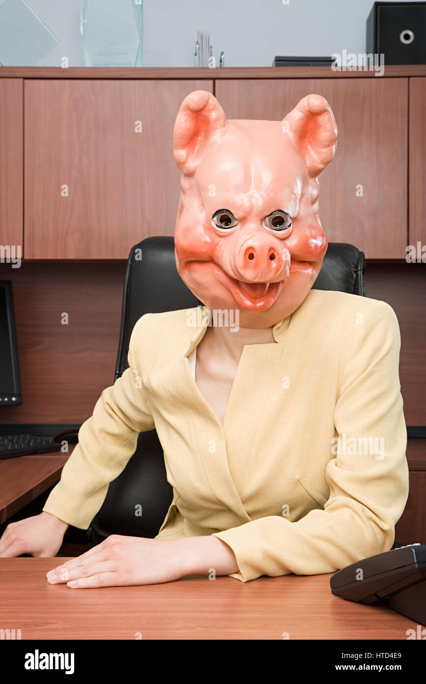 Portrait of businesswoman in a pig mask Stock Photo Alamy