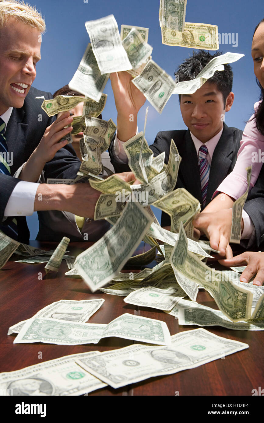 Businesspeople throwing money Stock Photo Alamy
