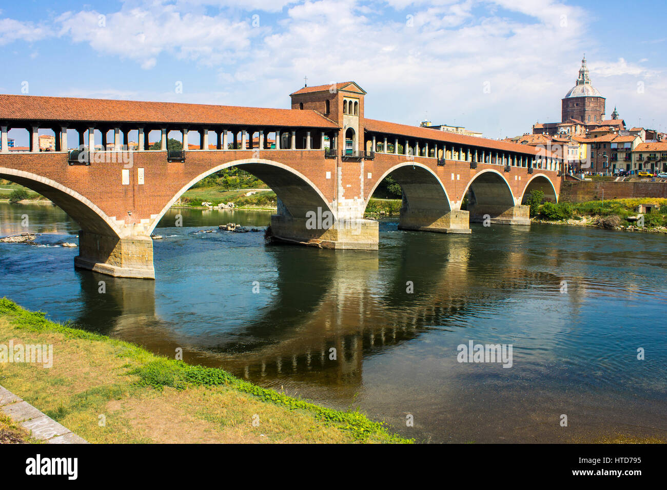 The Ponte Coperto (covered bridge), also known as the Ponte Vecchio (old bridge), a brick and stone arch bridge over the Ticino River in Pavia, Italy. Stock Photo