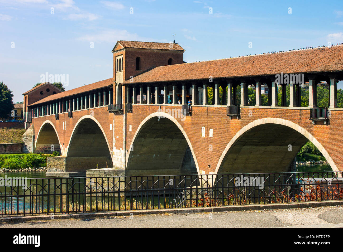 The Ponte Coperto (covered bridge), also known as the Ponte Vecchio (old bridge), a brick and stone arch bridge over the Ticino River in Pavia, Italy. Stock Photo