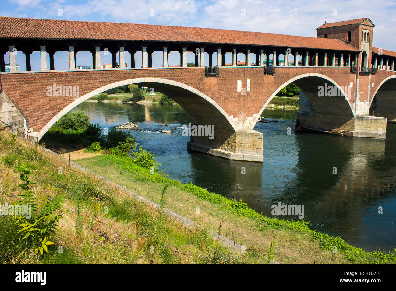 The Ponte Coperto (covered bridge), also known as the Ponte Vecchio (old bridge), a brick and stone arch bridge over the Ticino River in Pavia, Italy. Stock Photo