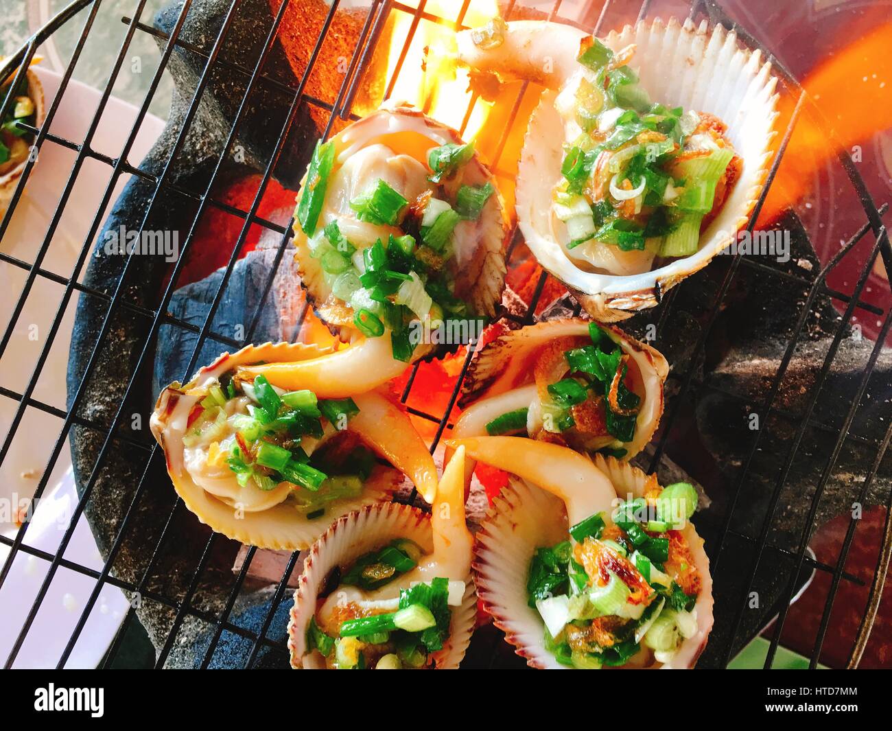 Delicious shell or clams mussels on hot fire coal grill Stock Photo