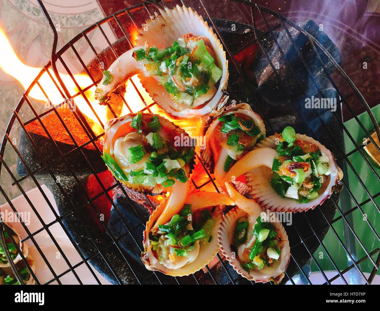 Delicious shell or clams mussels on hot fire coal grill Stock Photo