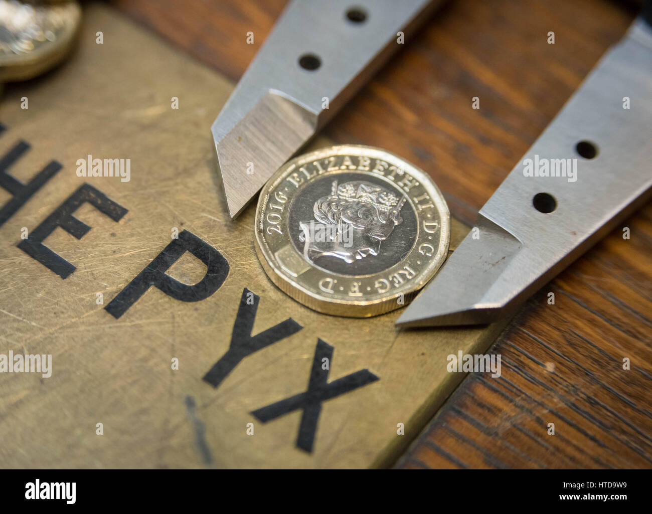 London, UK. 9th Mar, 2017. New £1 coins tested in the London Assay office ahead of their release 28th March, 2017. Pictured: In the Assay office, new £1 coins on the Pyx box, awaiting their trial. The Coins are the Realm are tested by diameter, weight and composition. Credit: Guy Corbishley/Alamy Live News Stock Photo