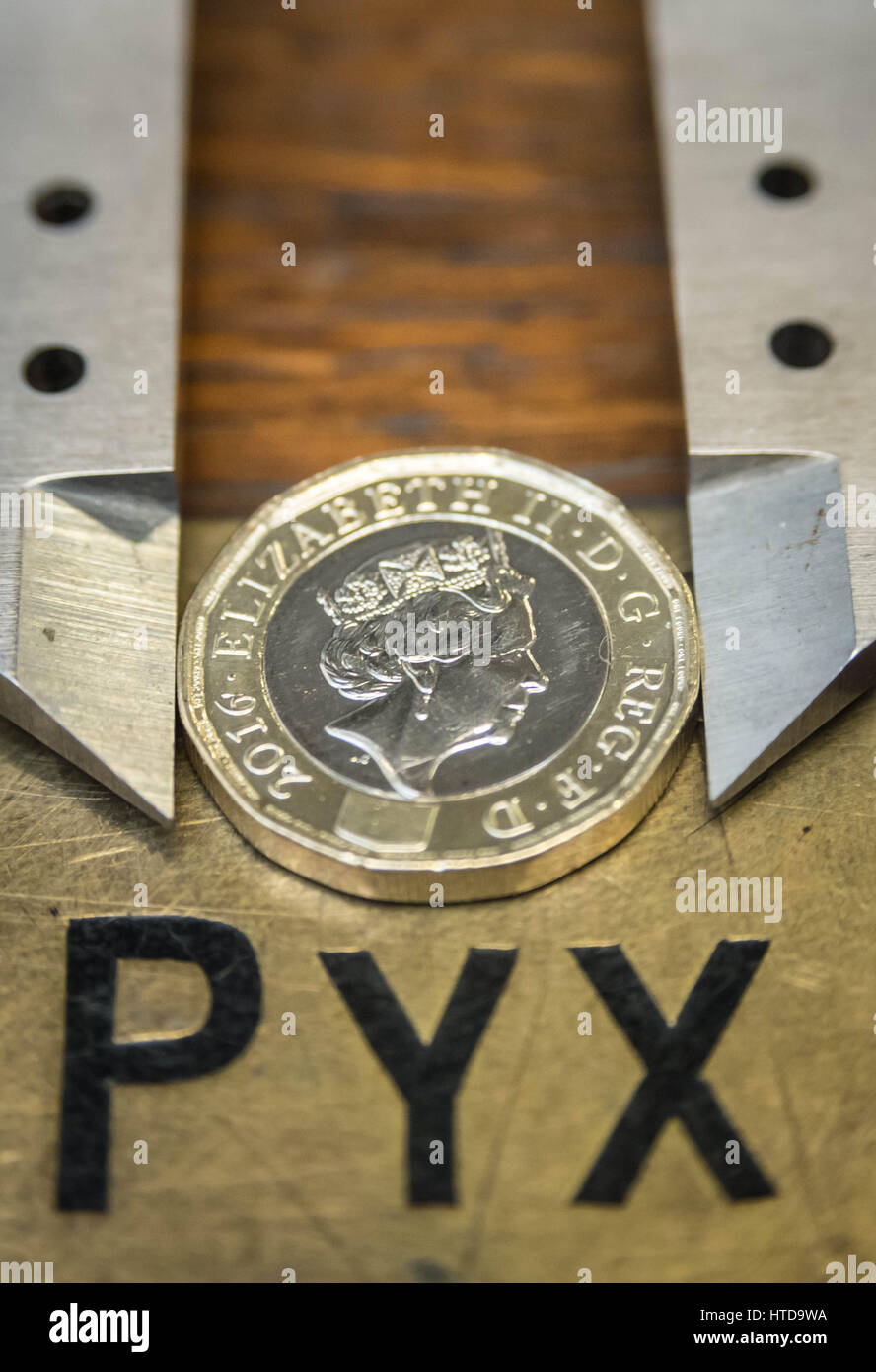 London, UK. 9th Mar, 2017. New £1 coins tested in the London Assay office ahead of their release 28th March, 2017. Pictured: In the Assay office, new £1 coins on the Pyx box, awaiting their trial. The Coins are the Realm are tested by diameter, weight and composition. Credit: Guy Corbishley/Alamy Live News Stock Photo