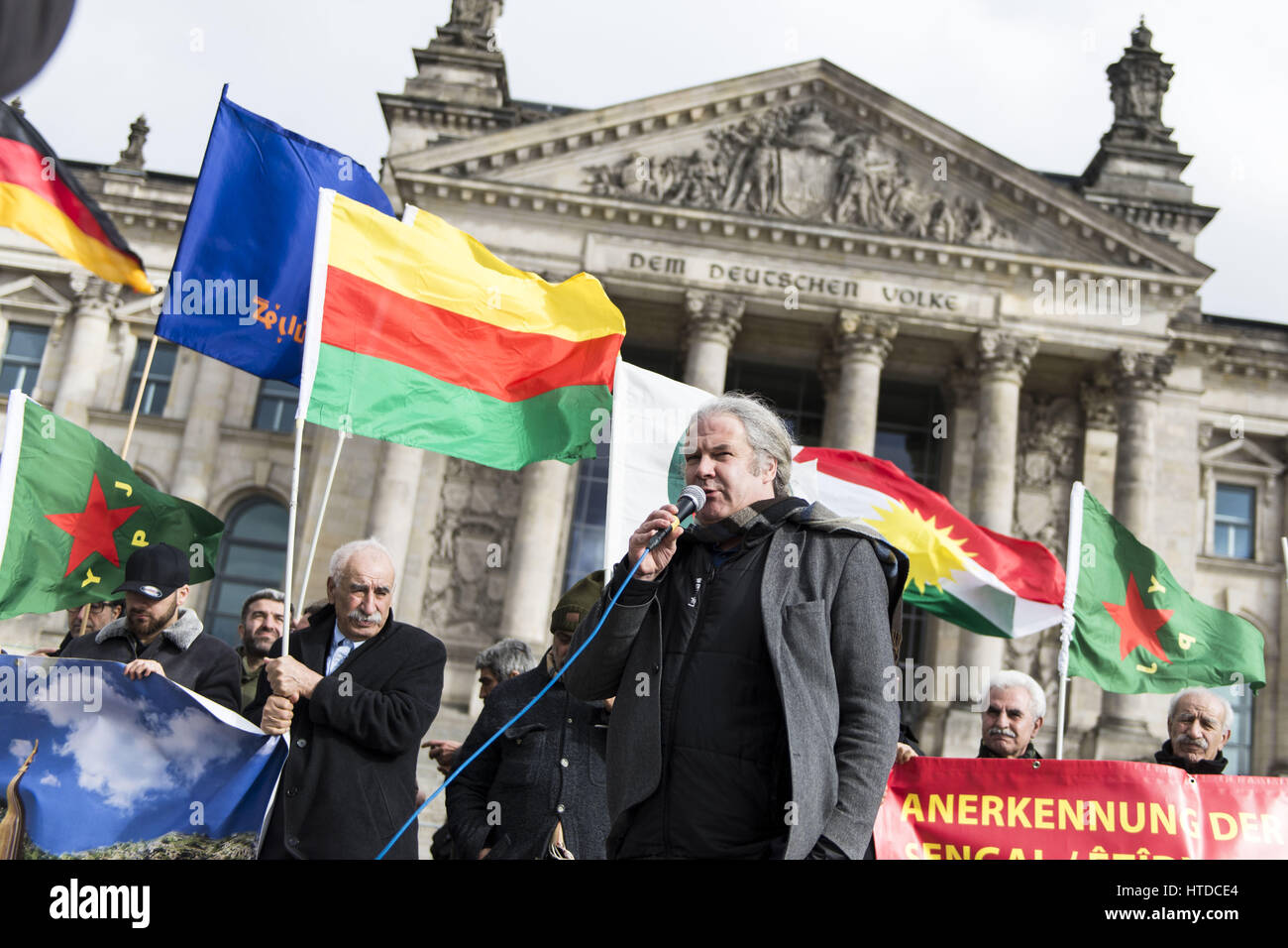 Berlin, Germany. 10th Mar, 2017. ANDREJ HUNKO, Mitglied des Deutschen Bundestags fÃ¼r die Partei Die Linke, speaks in front of the protesters. Yezidi representatives and Kurds demanding political support in front of the German Reichstag-Building for the people in Sinjar. The situation of the Yezidians, a thousand-year monotheistic religious community, has worsened after Kurdish Peschmergas attacked the Kurdish Yezidian units in Shengal. Credit: Jan Scheunert/ZUMA Wire/Alamy Live News Stock Photo