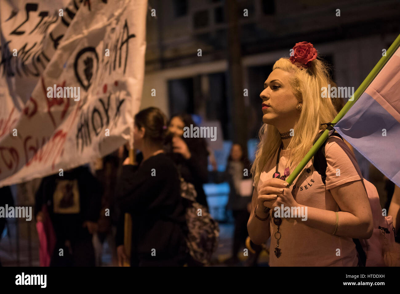 Women and men march in the streets of Athens shouting slogans and holding placards. Feminist, leftist and human rights organizations staged a demonstration to honor International Women's Day and demand equal rights. © Nikolas Georgiou / Alamy Live News Stock Photo