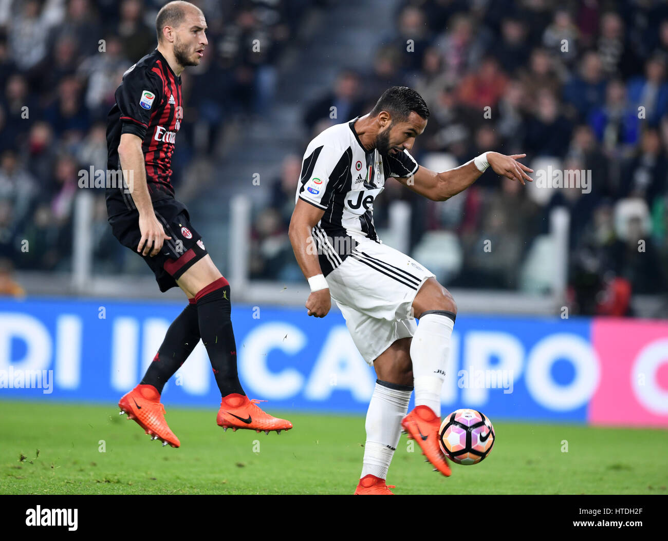 Turin, Italy. 10th Mar, 2017. Medhi Benatia (R) of Juventus scores during the Italian Serie A soccer match between Juventus and AC Milan, in Turin, Italy, March 10, 2017. Juventus won 2-1. Credit: Alberto Lingria/Xinhua/Alamy Live News Stock Photo