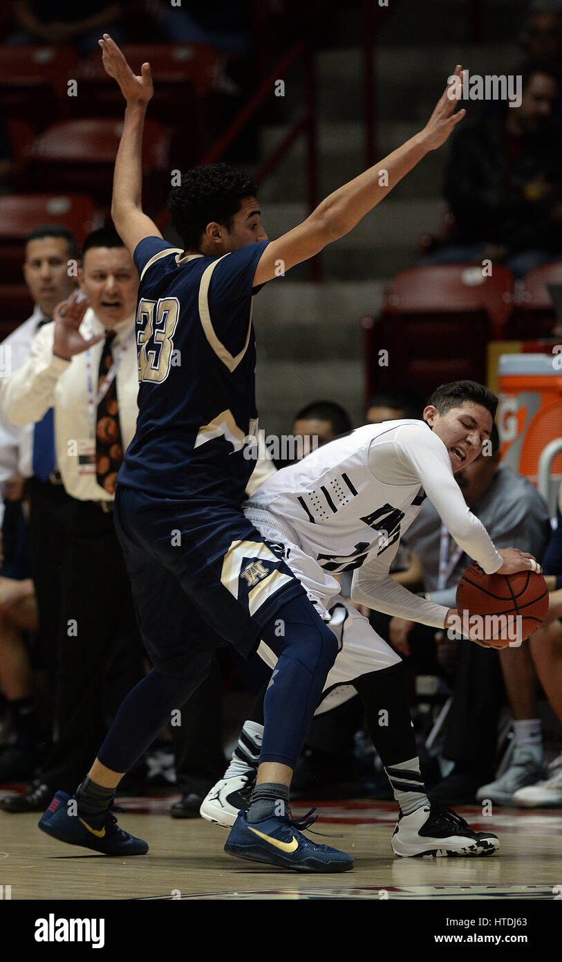 Albuquerque, NEW MEXICO, USA. 8th Mar, 2017. JOURNAL.Atrisco Heritage Academy 's Jordan Arroyo, left defends Onate's Antonio Zamora, during the 6A Boys State Basketball game played at the Pit. Photographed on Wednesday March 8, 2017. Adolphe Pierre-Louis/JOURNAL. Credit: Adolphe Pierre-Louis/Albuquerque Journal/ZUMA Wire/Alamy Live News Stock Photo