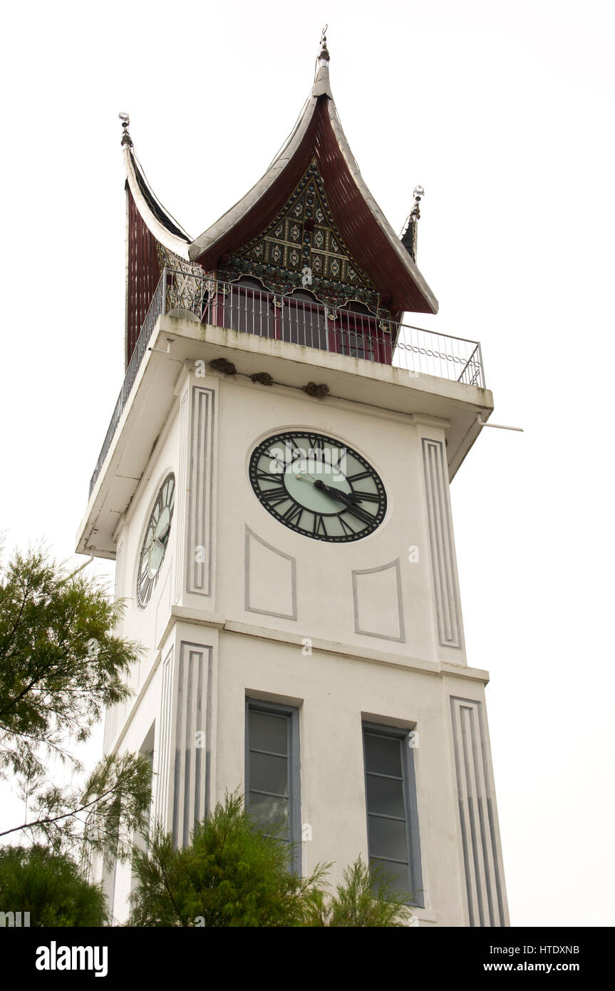 Jam Gadang, Bukittinggi white clock tower in central Bukittinggi, a city in the Minangkabau Highlands of West Sumatra. It sits in the middle of the Sa Stock Photo