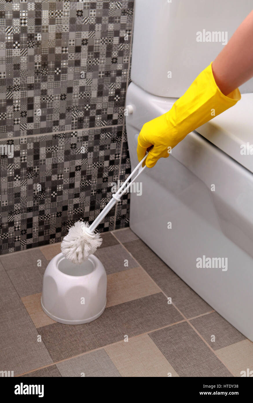 cleaning of white toilet bowl in yellow rubber gloves Stock Photo Alamy