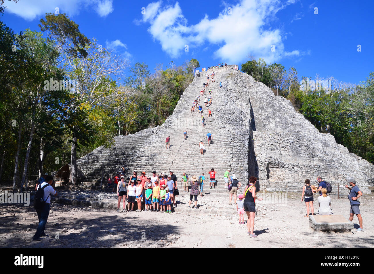 tourists climbing coba ruins mexico Stock Photo