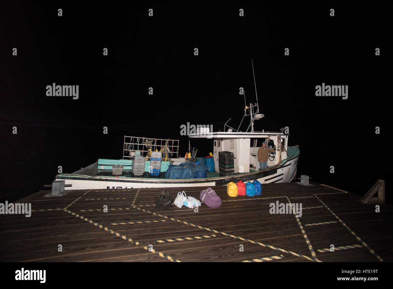 Lobster boat heading out at 5 a.m. for a day of fishing. Yarmouth Stock