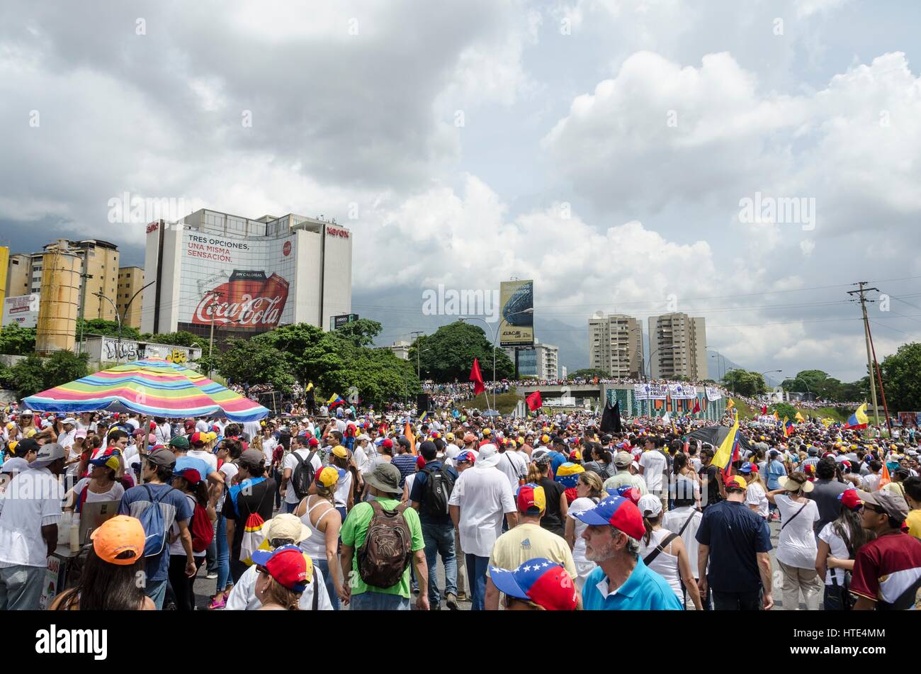 Demonstrators march during the anti-government protests in Caracas. Stock Photo