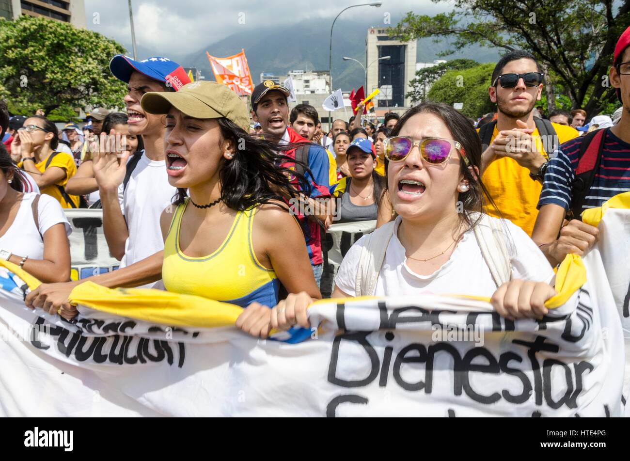 Demonstrators march during the anti-government protests in Caracas. Stock Photo