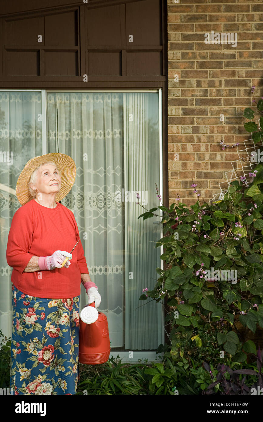 Senior woman gardening Stock Photo - Alamy
