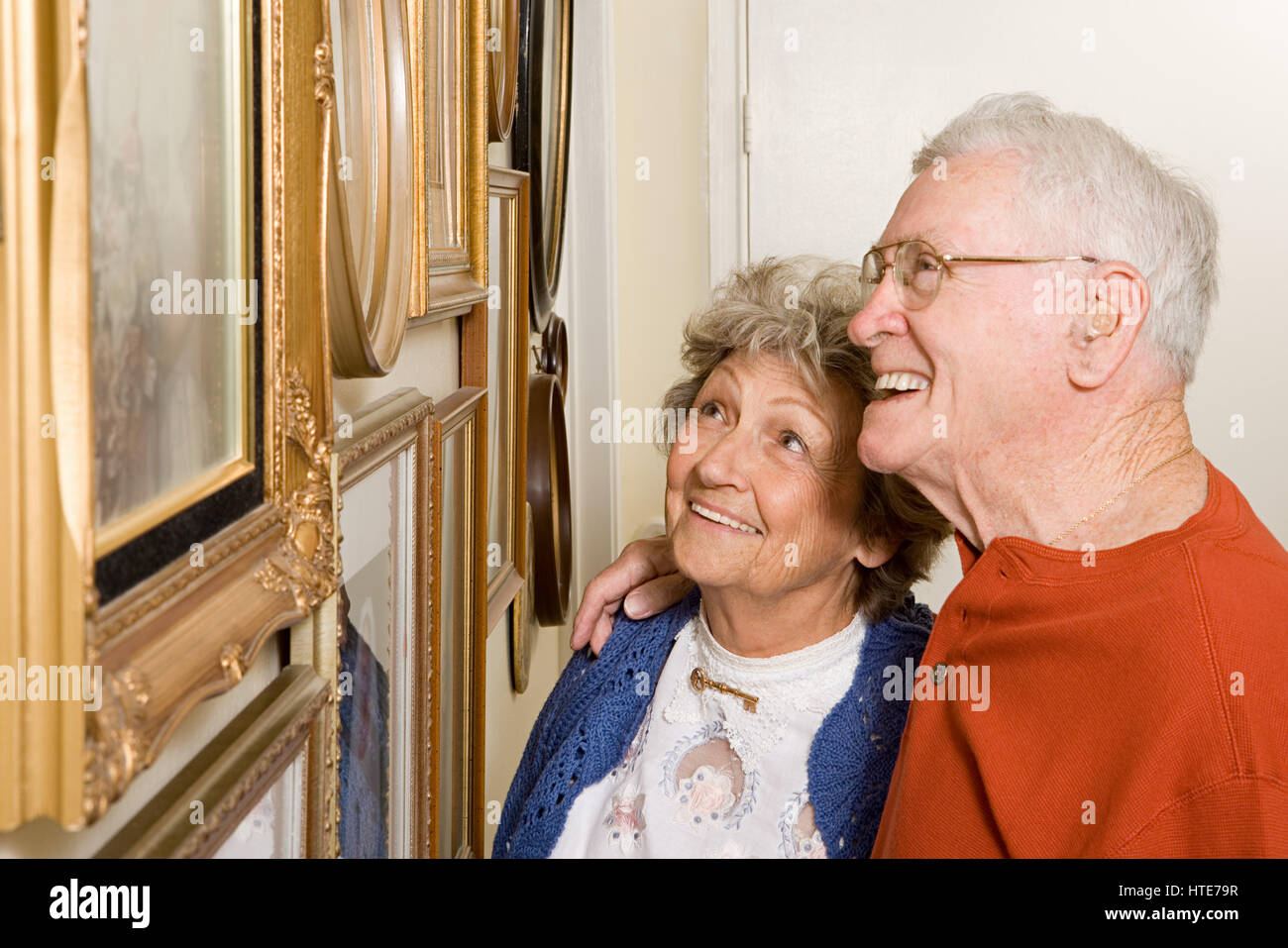 Senior couple looking at photographs Stock Photo - Alamy