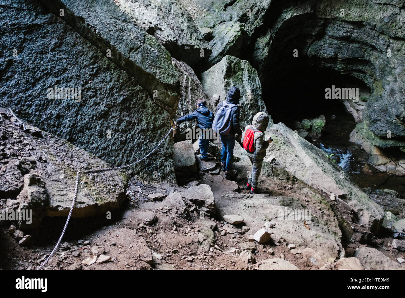 Children explore underground cavern Stock Photo Alamy