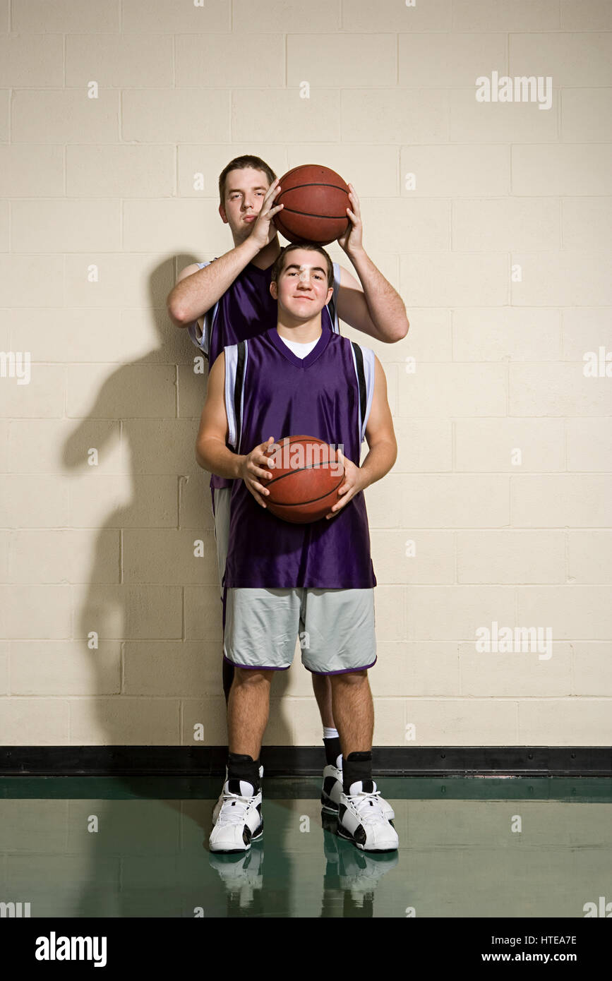 Tall and short basketball players Stock Photo Alamy